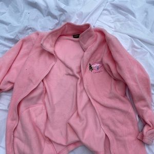 Soft pink zip-up sweatshirt.